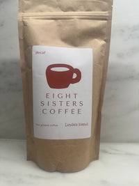 Eight Sisters Coffee 12oz Linda's Blend - Decaf Ground Coffee package on a marble surface