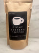 Eight Sisters Coffee 12oz Mary's Blend - Dark Roast Coffee Whole Beans in package on a marble surface
